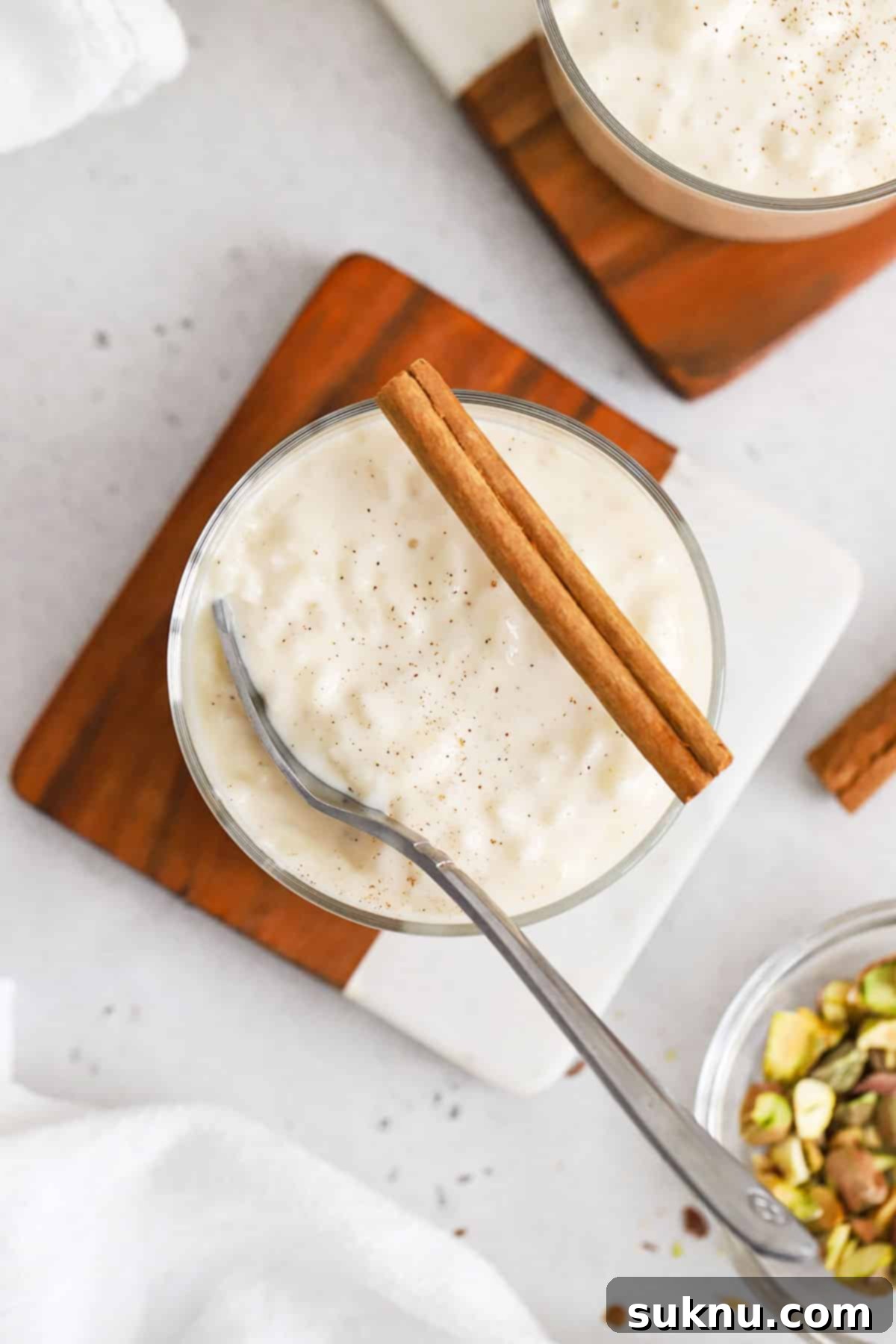 Velvety Gluten-Free Rice Pudding 6 glass bowls of gluten-free rice pudding topped with cinnamon sticks