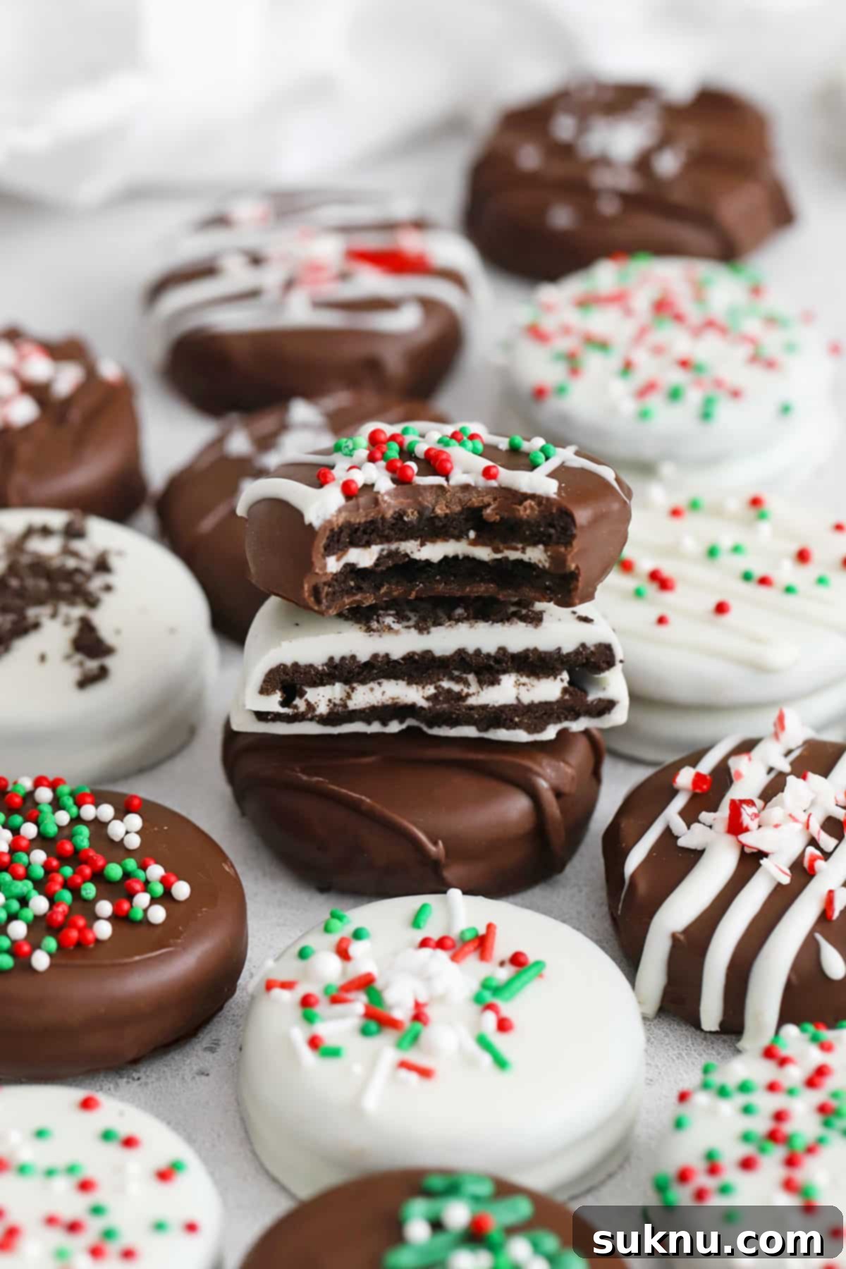 No-Bake Chocolate Dipped Oreos 2 Festive gluten-free chocolate covered Oreos adorned with red and green holiday decorations, perfect for a joyful celebration.