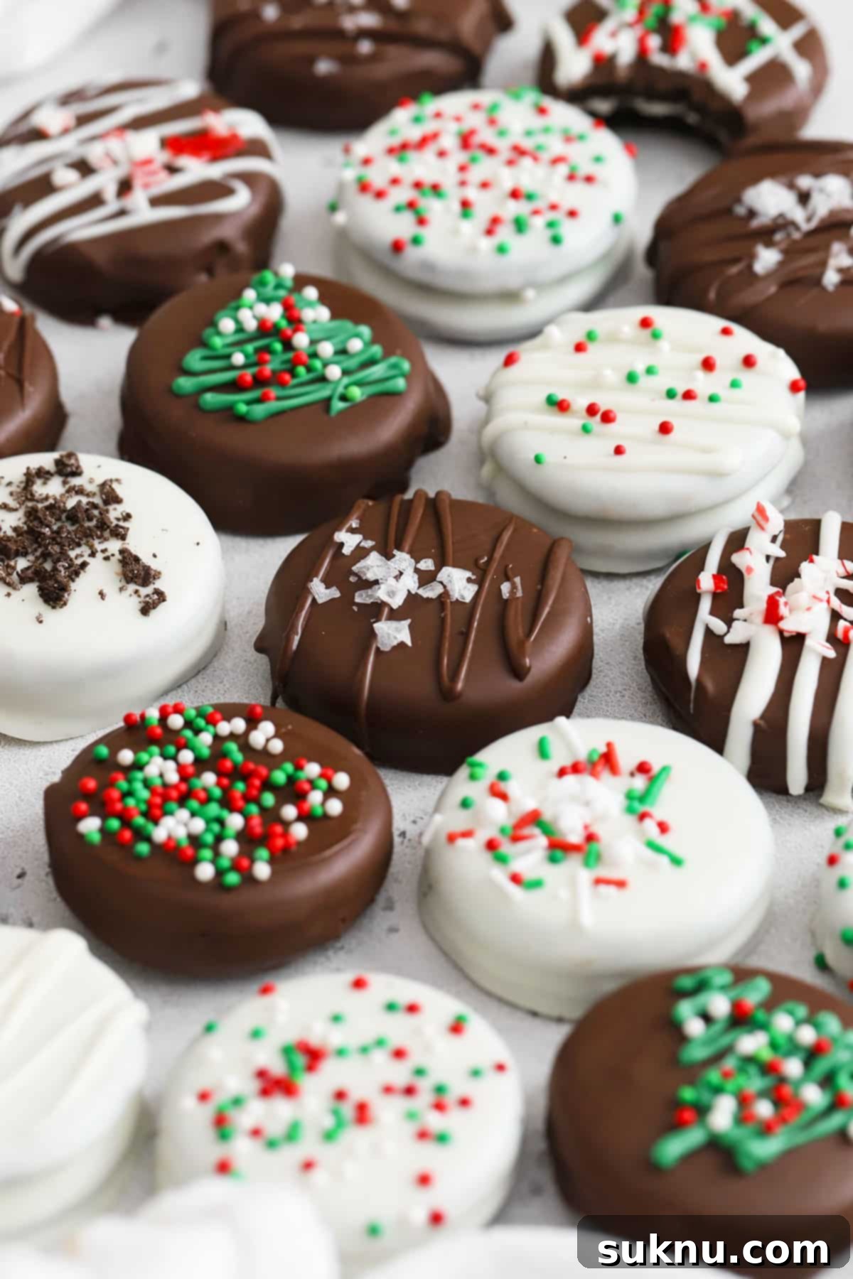 No-Bake Chocolate Dipped Oreos 6 A beautiful array of gluten-free chocolate covered Oreos, each adorned with unique and delicious toppings, showcasing versatility.