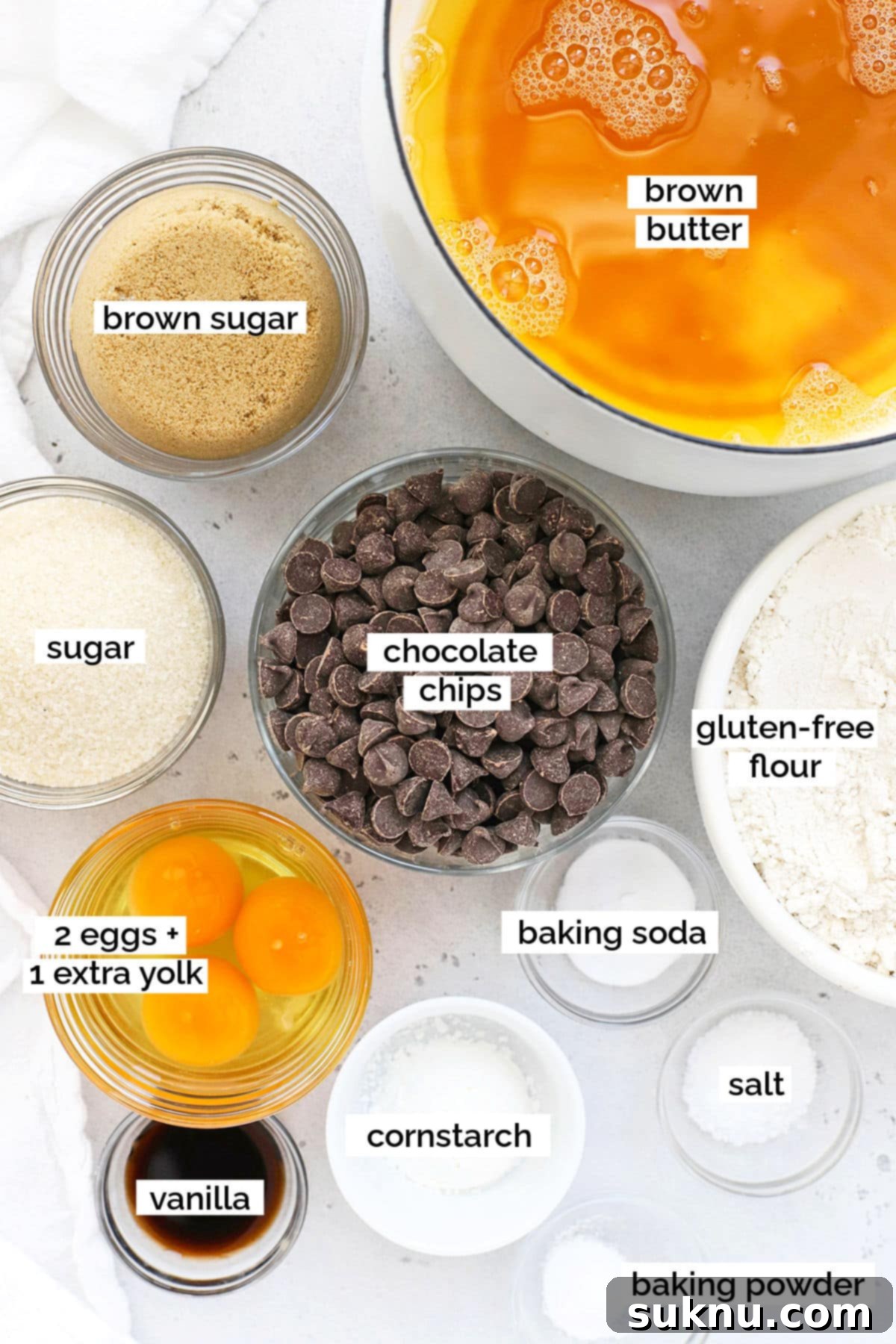 Essential ingredients for baking delicious gluten-free brown butter chocolate chip cookies displayed artfully.