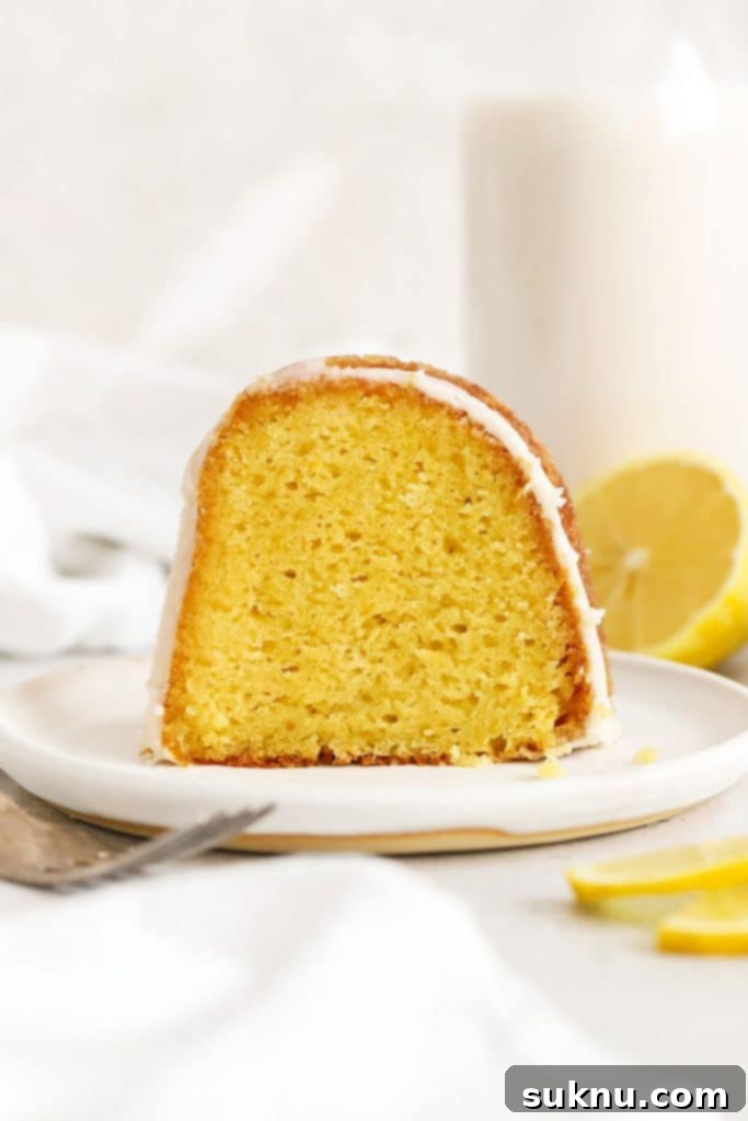 Simple Scratch-Made Lemon Curd 9 A slice of gluten-free lemon bundt cake on a white plate