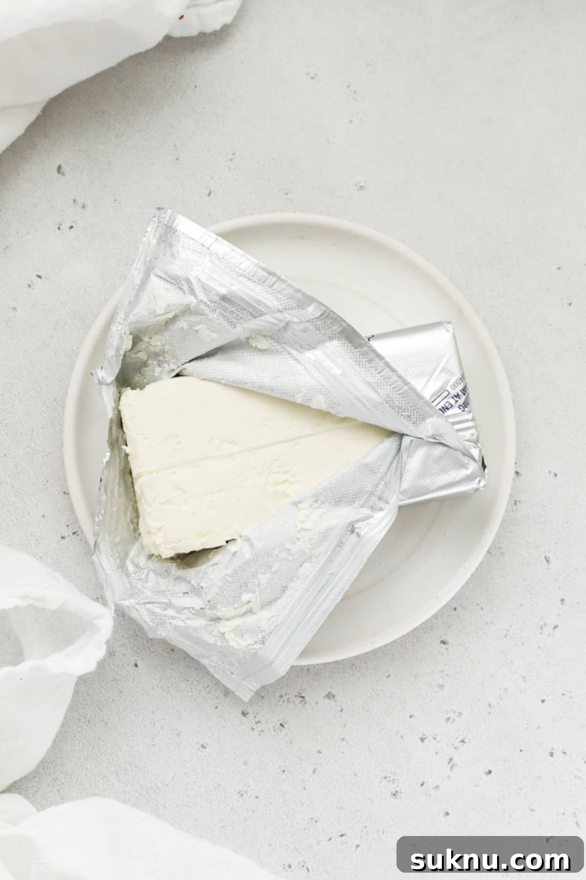 Soft Cream Cheese in Minutes 12 unwrapping a block of cream cheese