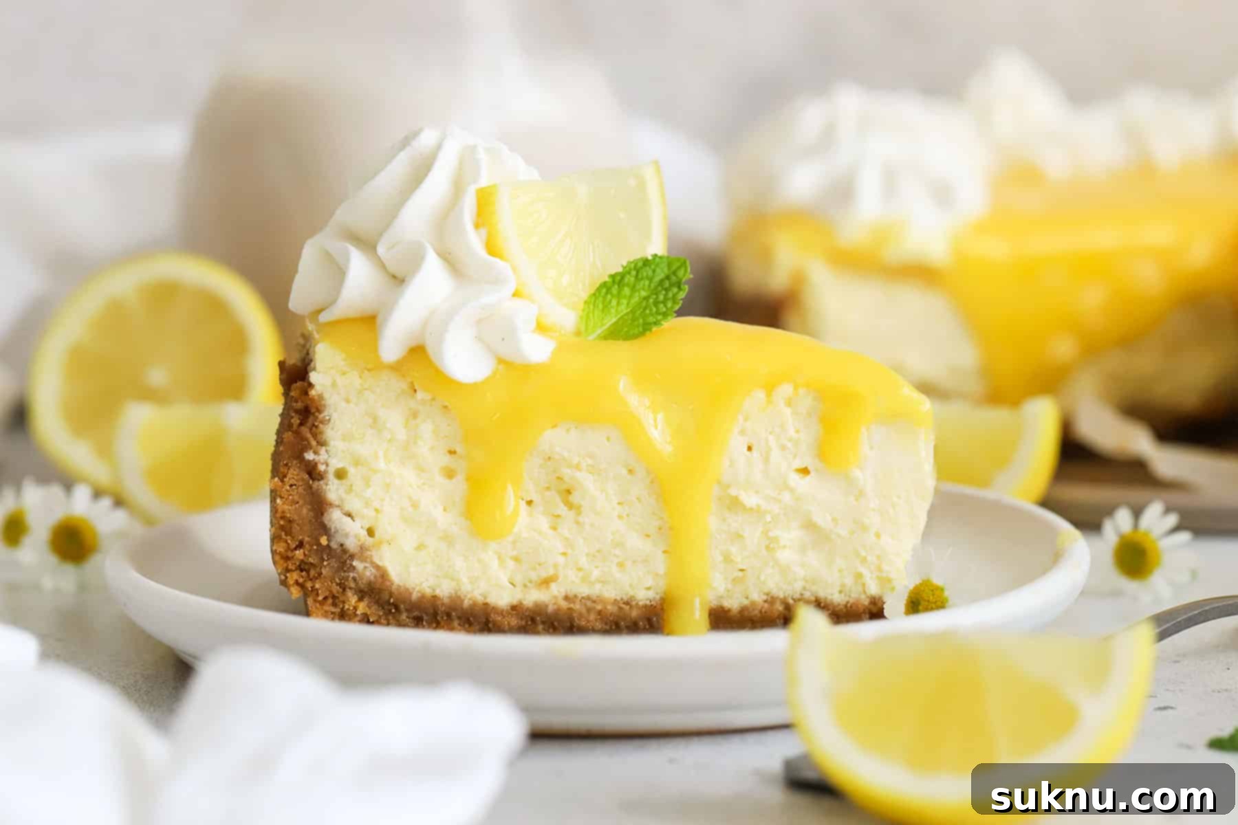 Soft Cream Cheese in Minutes 3 A delectable slice of gluten-free lemon cheesecake, garnished with homemade lemon curd, signifying perfect cream cheese texture